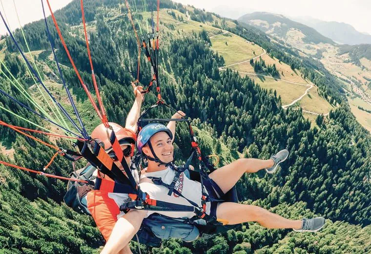 Men during a paraglider flight