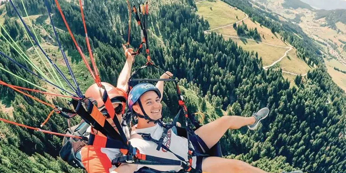 Men during a paraglider flight
