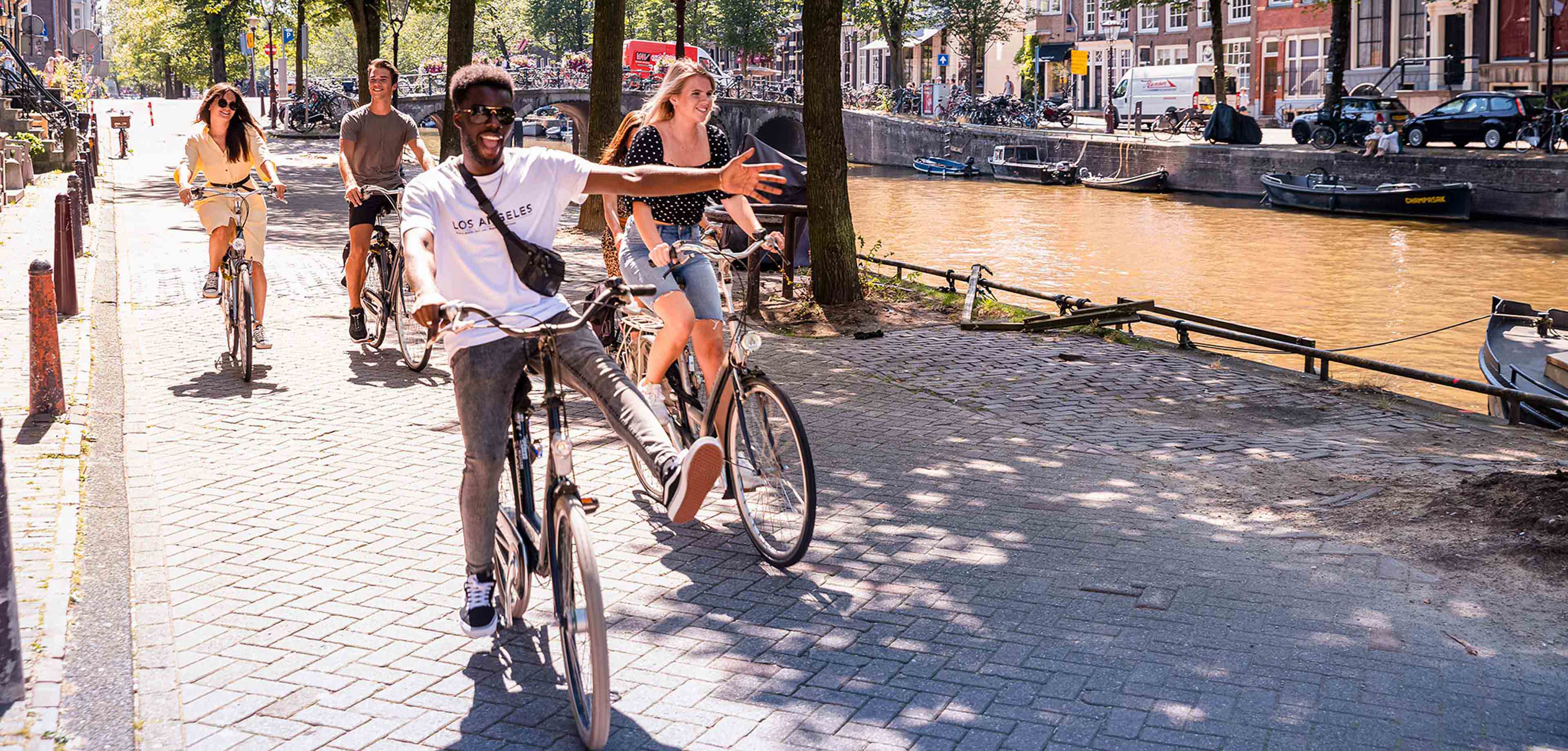 Friends biking in Amsterdam