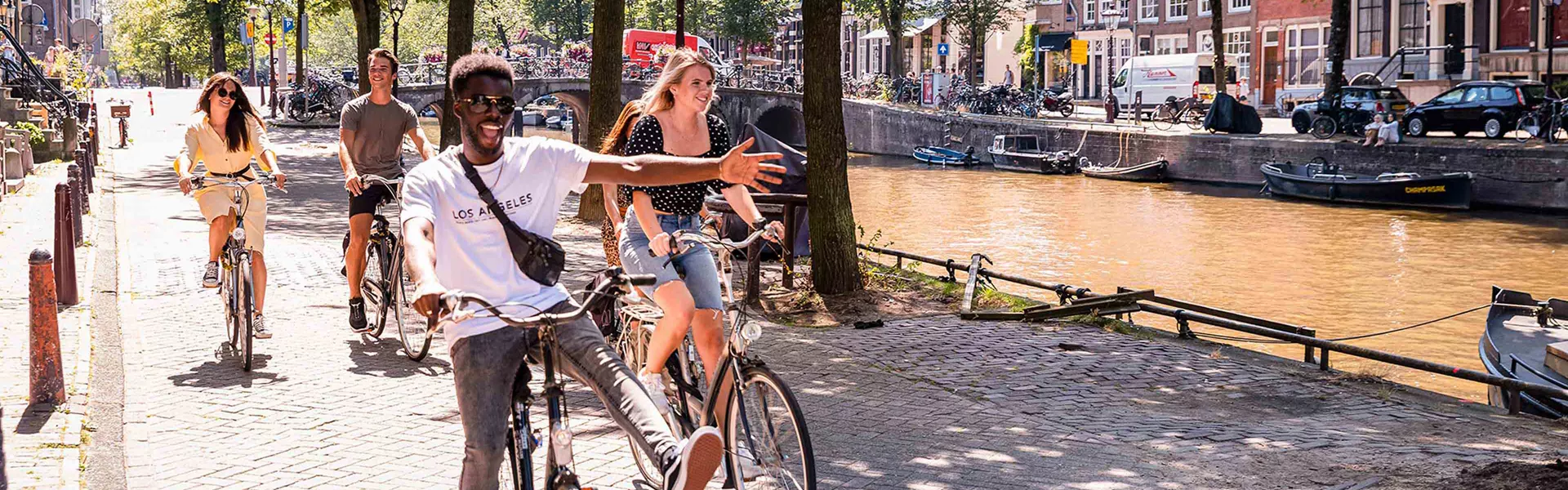 Friends biking in Amsterdam