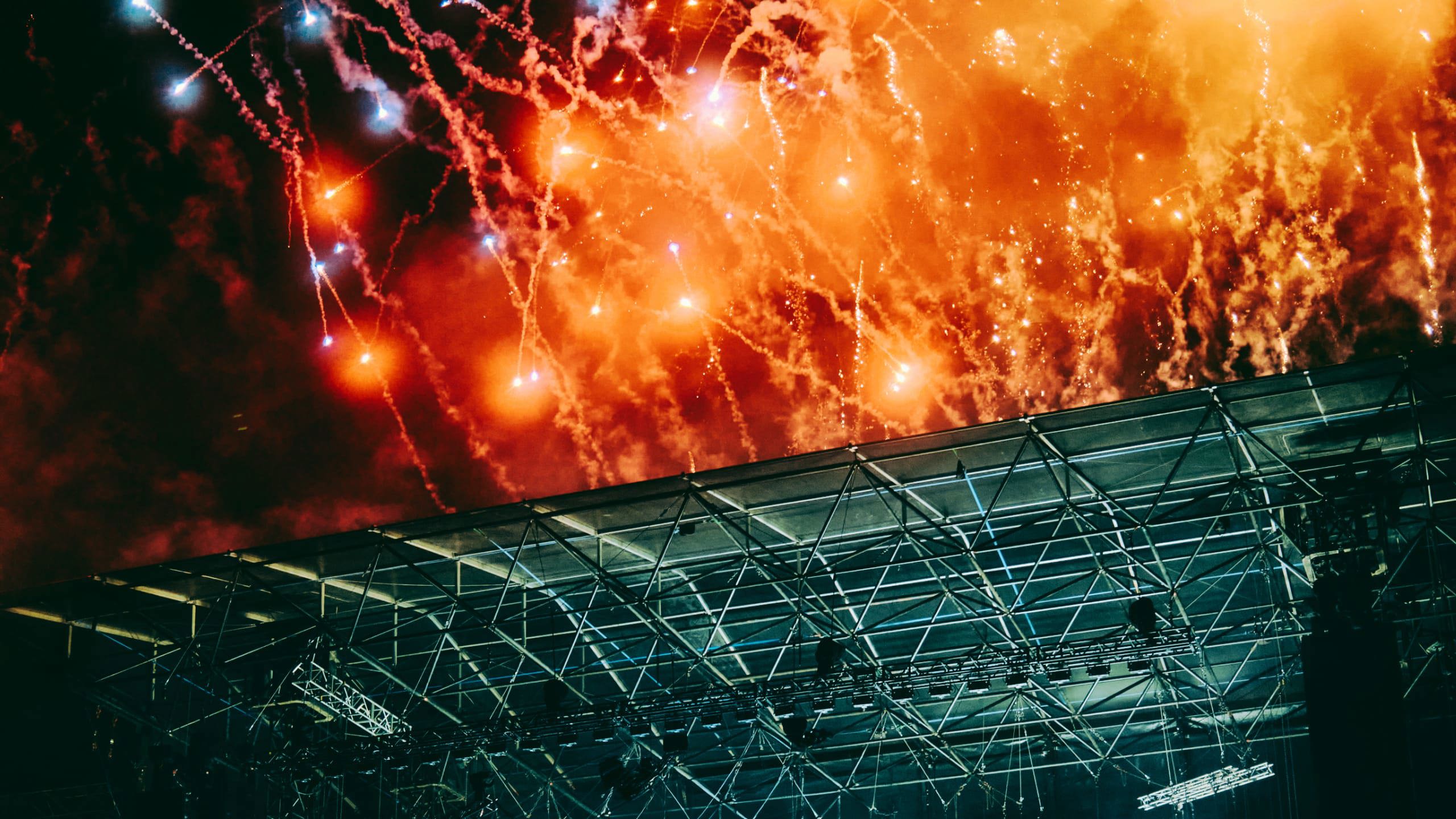 Spectacular fireworks exploding over the main stage at Ultra Music Festival in Split Croatia at night - Contiki Croatia Sail & Ultra Music Festival Tour