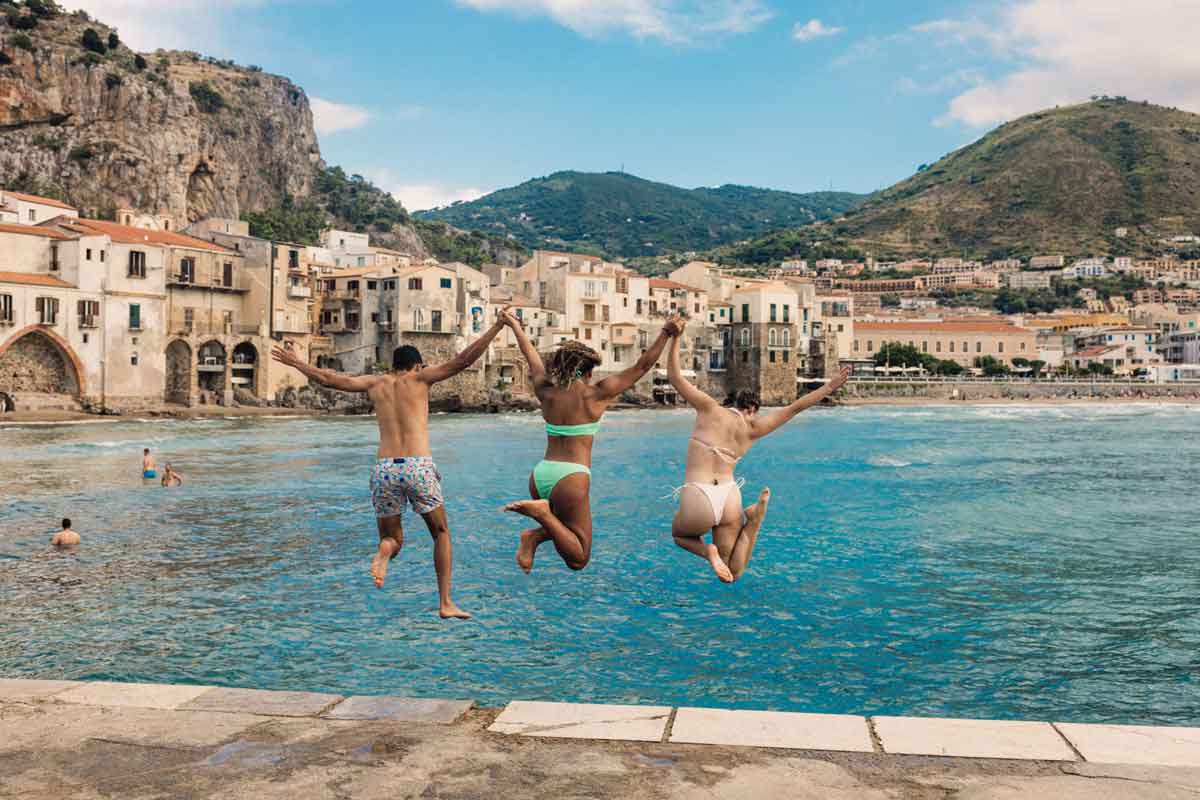 Travelers Jumping Into Sea Sicily