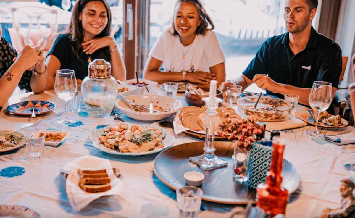 Group Of Contiki Travelers Enjoying Dinner