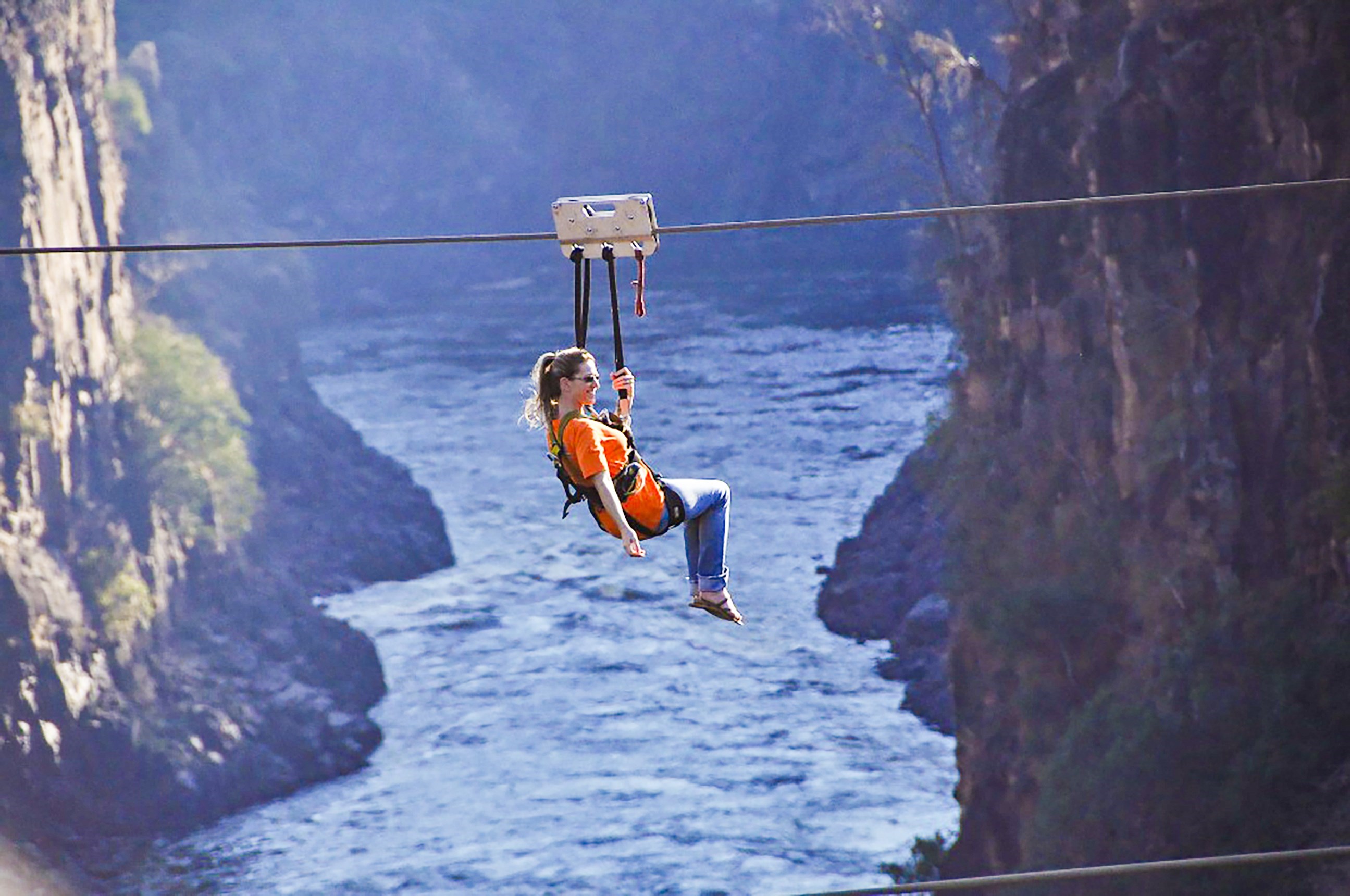 Traveller Gliding along Zipline during Gorge Slide Experience, Victoria Falls, Zimbabwe