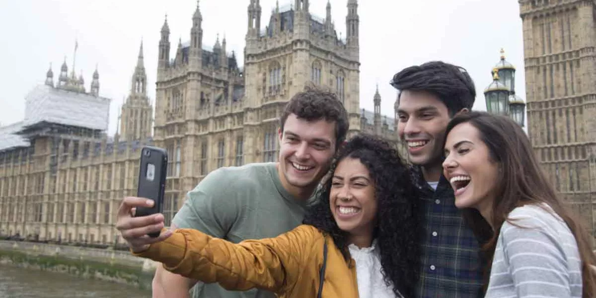 Group Taking Selfie Outside Houses Of Parliment London