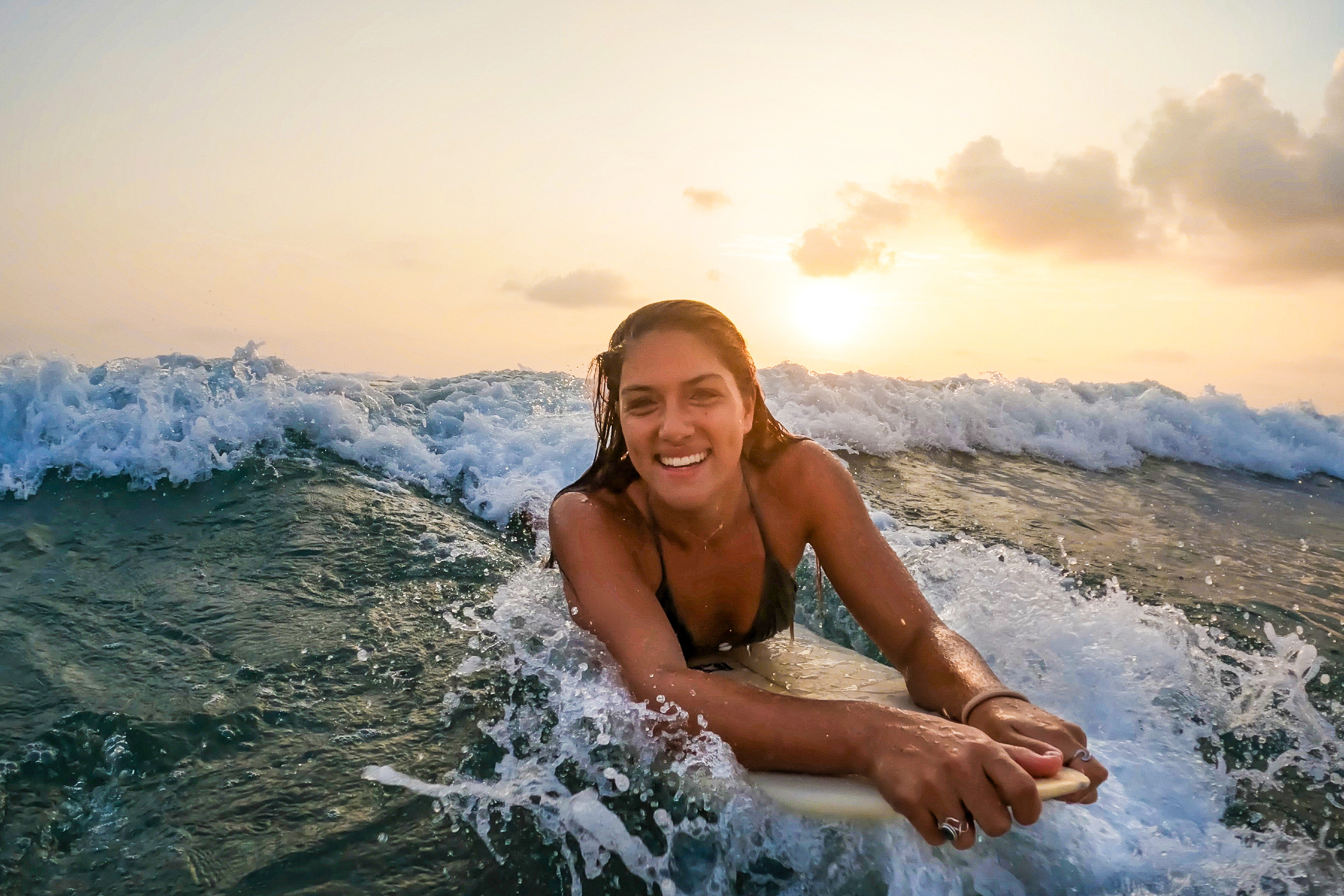 Travellers in the sea at Playa Tamarindo in Costa Rica