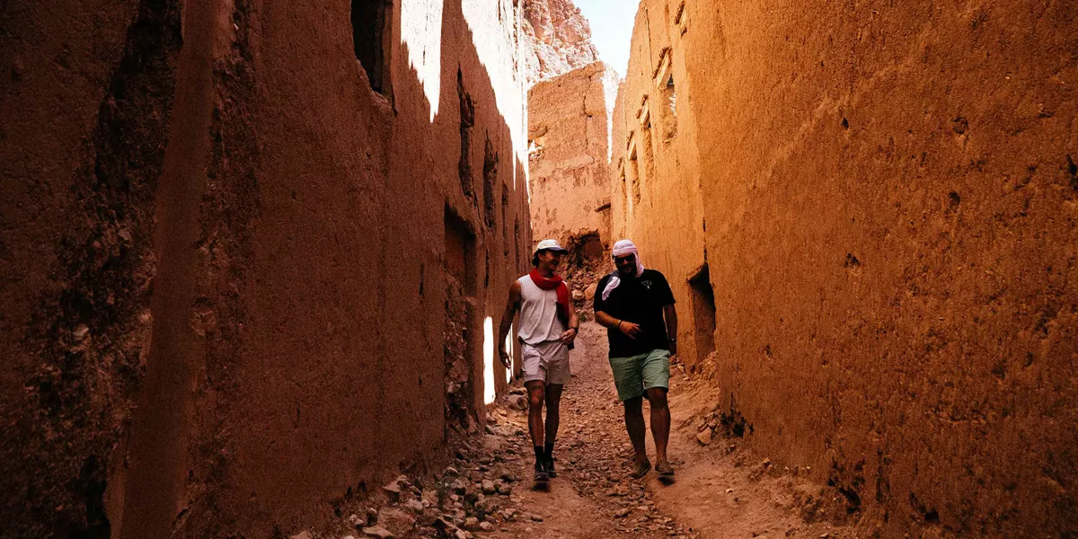 two males walking in streets of morocco