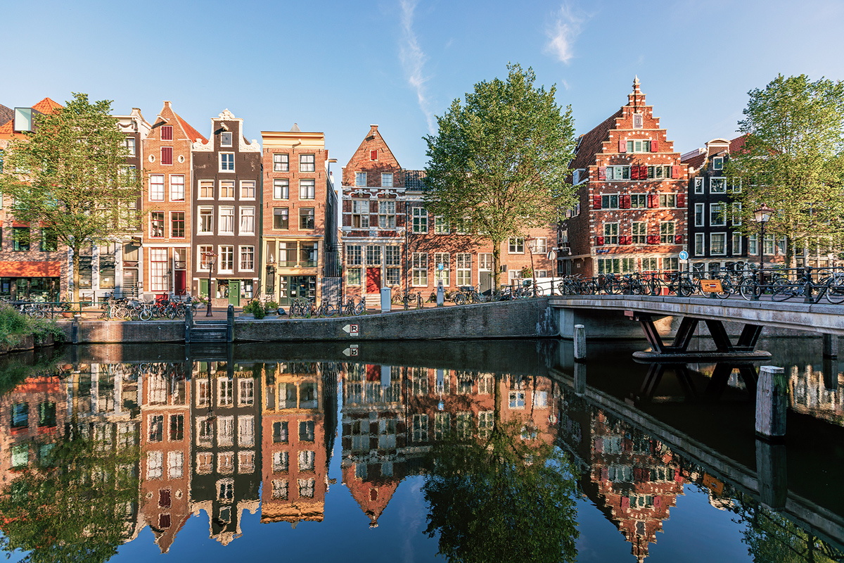 Buildings Reflected In Water In Netherlands