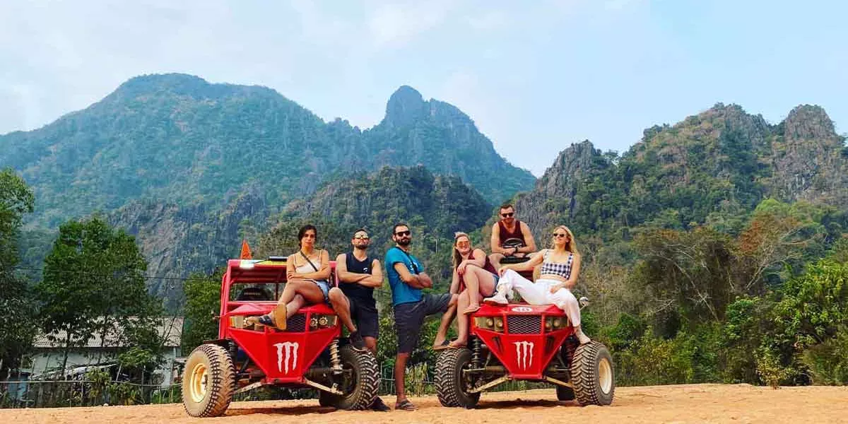 Tourists In Cambodia On Quad Bikes