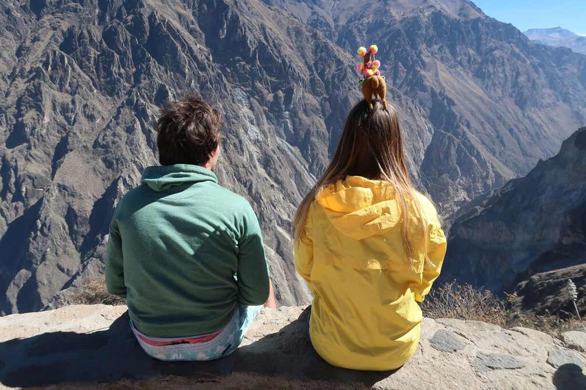 Two people looking at rocky mountains in Peru.