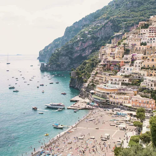 Panoramic view of Positano's colourful cliffside village and beach on the Amalfi Coast during the Contiki Amalfi Coast Tour