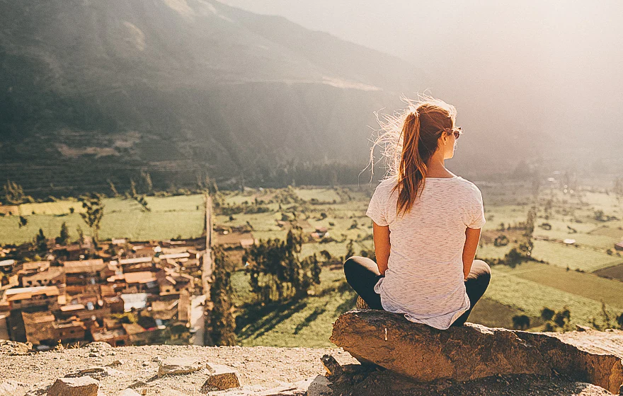 Woman Looking At Town Below