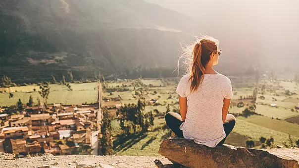 Woman Looking At Town Below