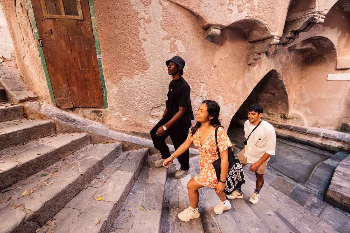 Three Young Happy People Walking Stairs Sicily Sunny Day