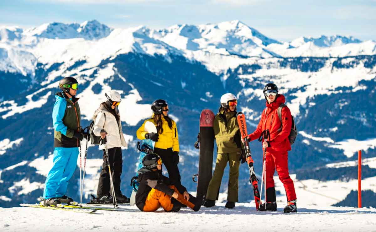 Group Of Snowboarders In The Moutains