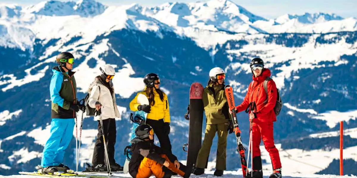 Group Of Snowboarders In The Moutains