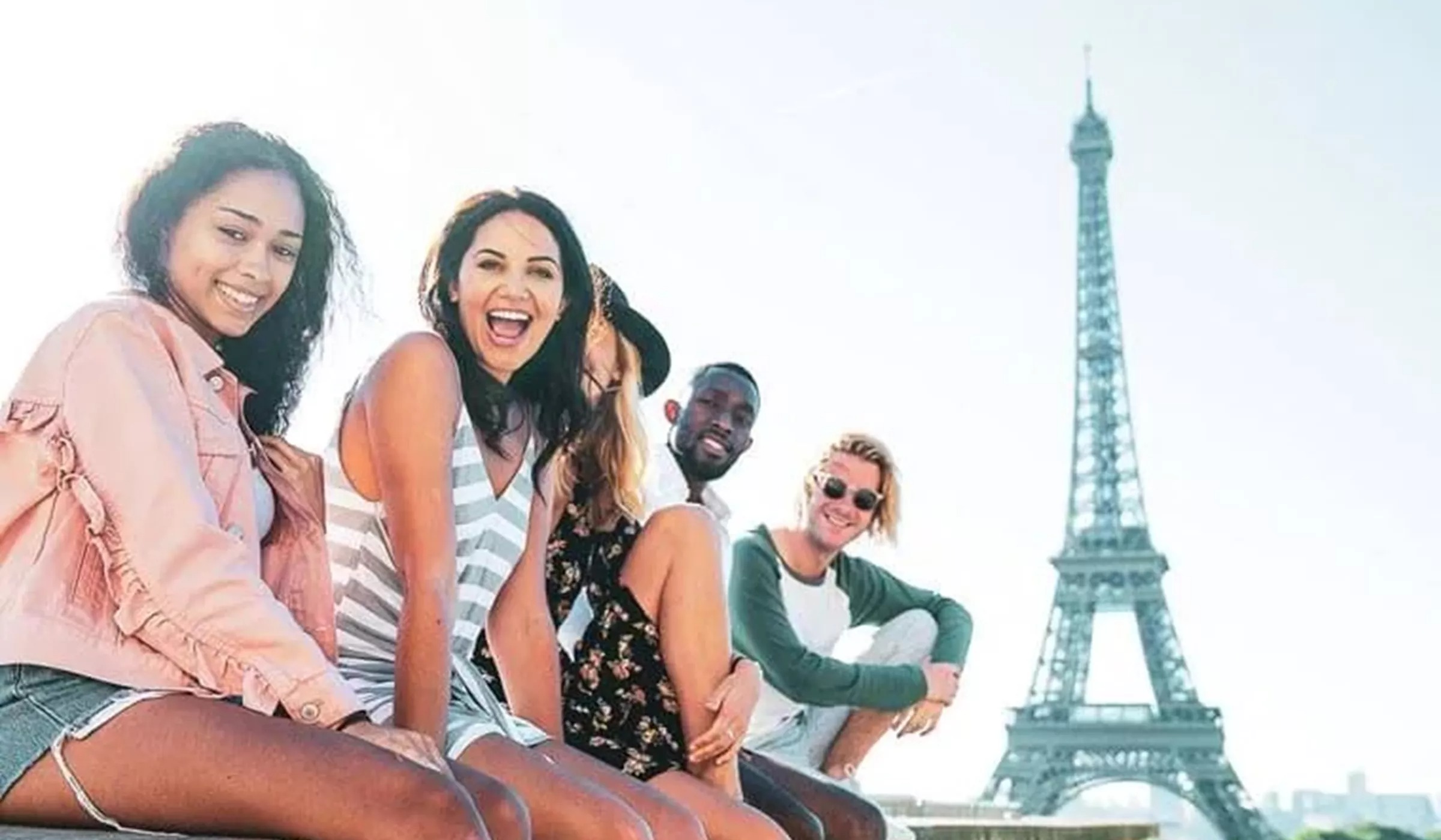 Travellers in front of Eiffel Tower in Paris, France
