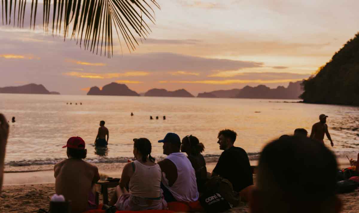 People Enjoying Sunset Beach