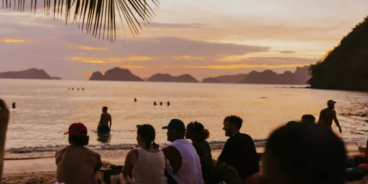 People Enjoying Sunset Beach
