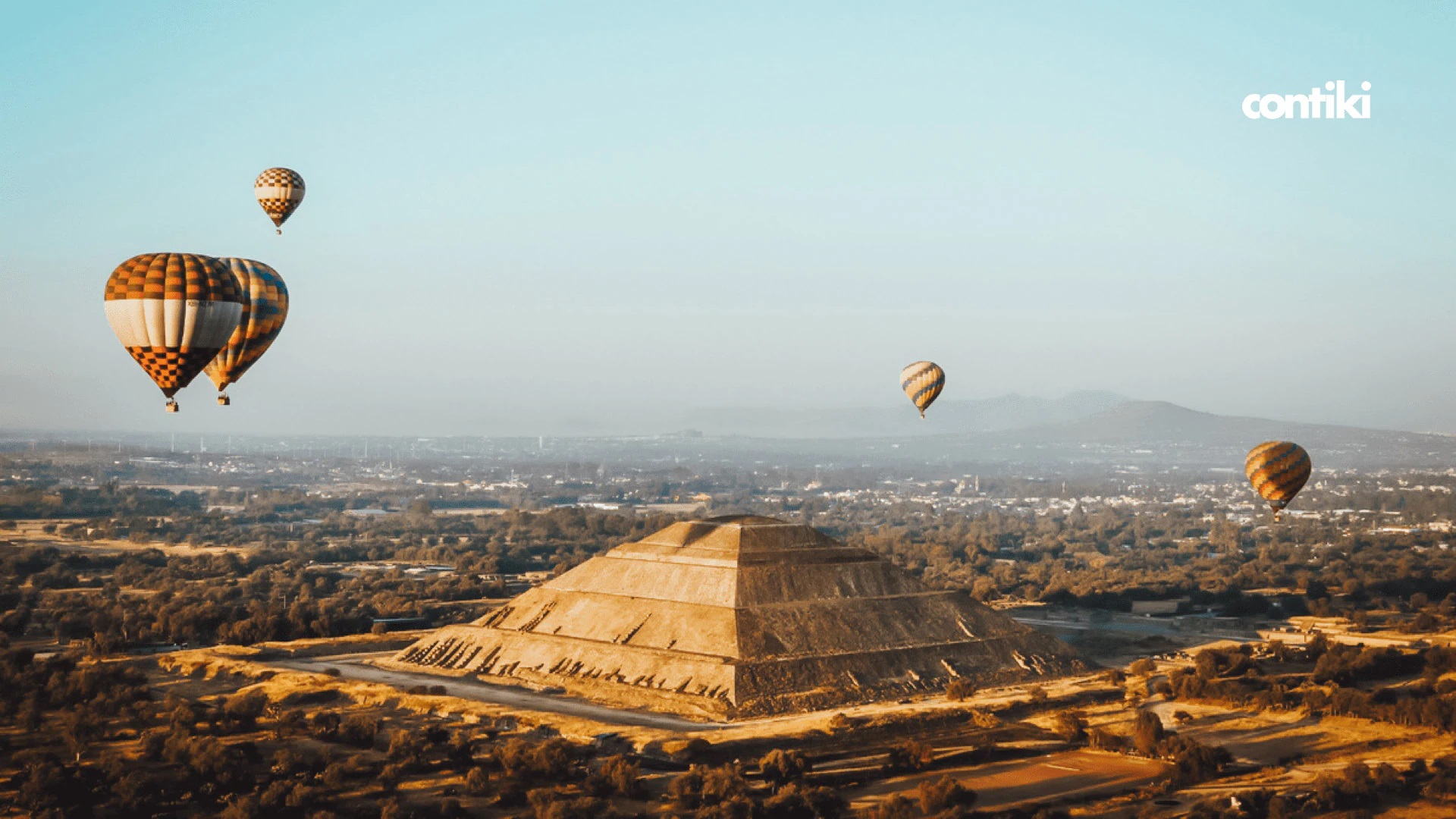 Balloons floating above the ancient pyramid