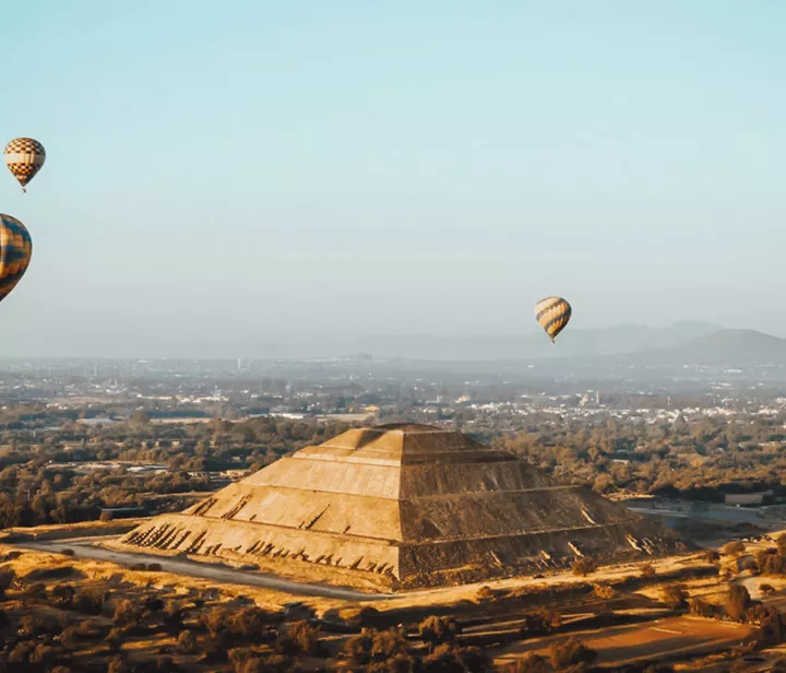 Balloons floating above the ancient pyramid
