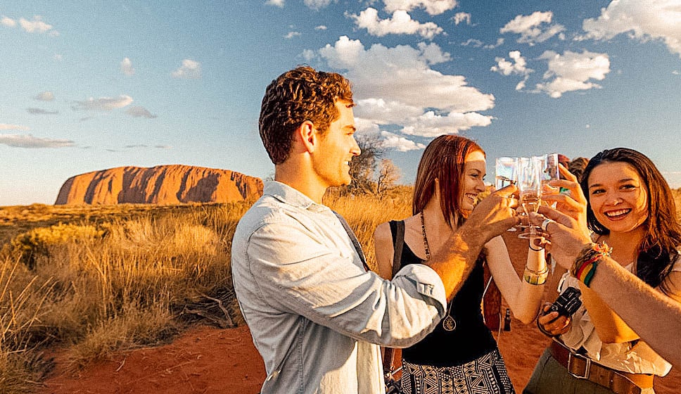Young people toasting in Uluru