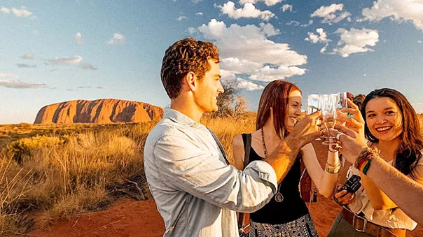 Young people toasting in Uluru