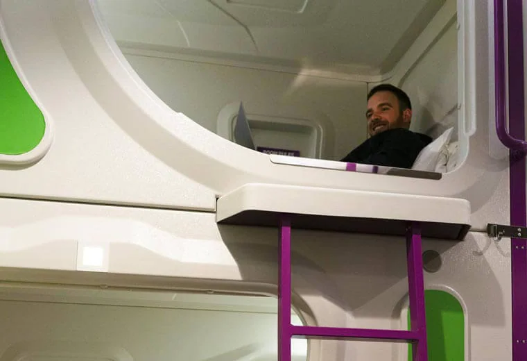 Smiling man on a bunk bed