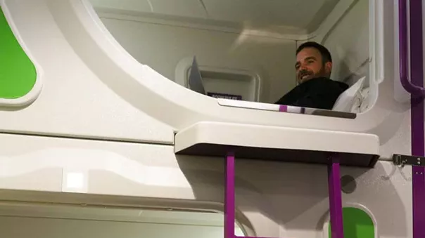 Smiling man on a bunk bed