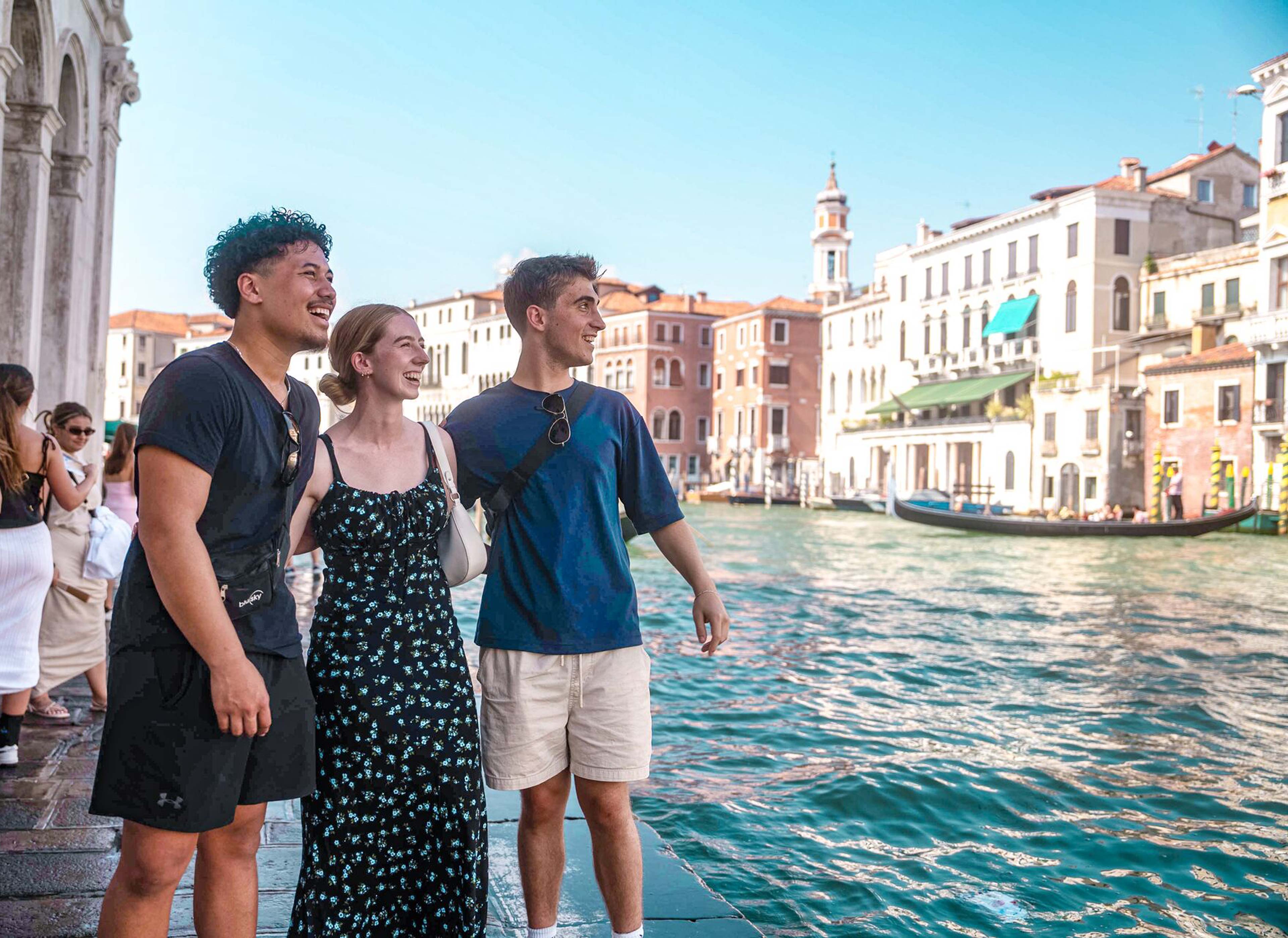 People Walking In Venice Close To Canal