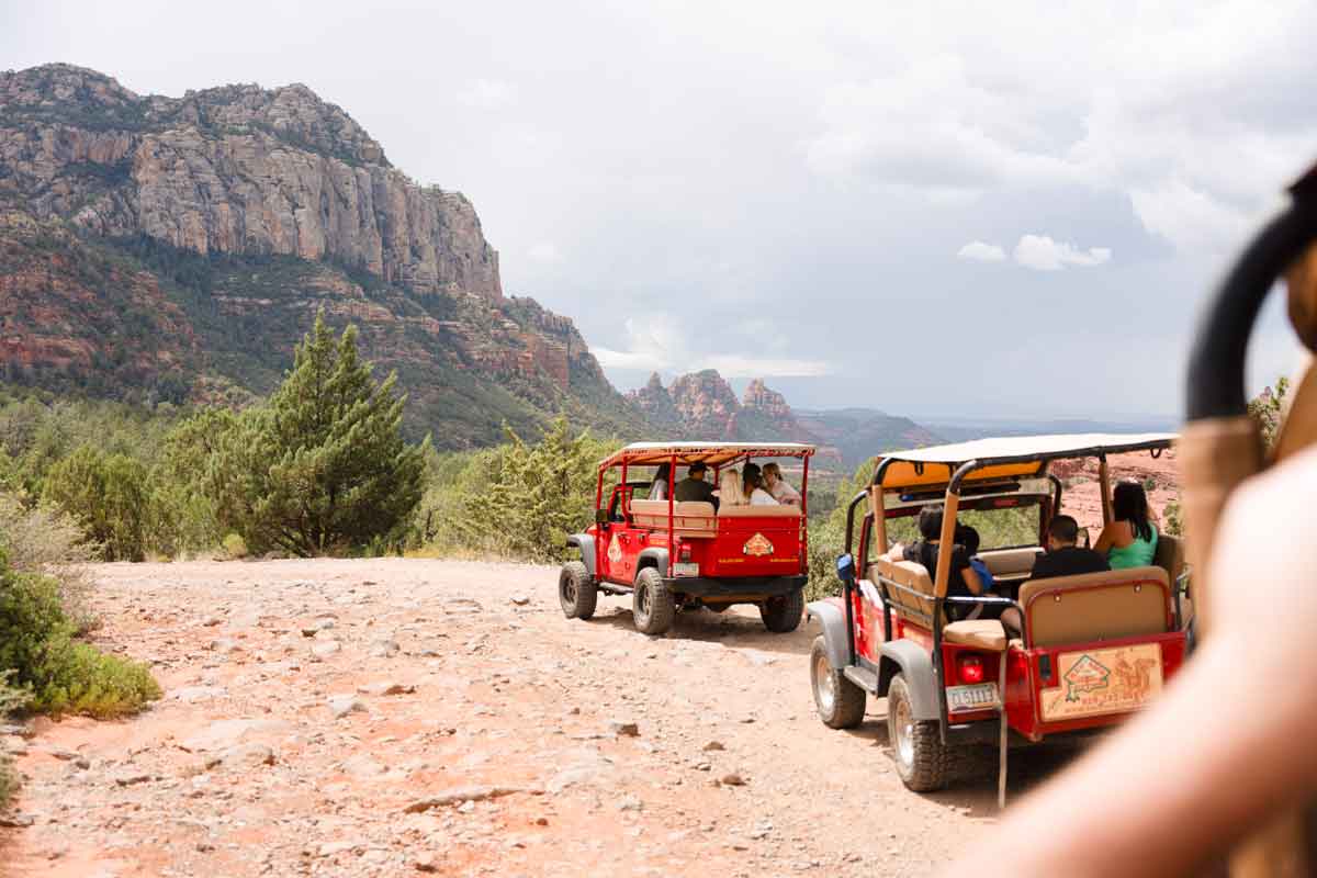 Group Of Travellers In Jeeps In Desert America Usa