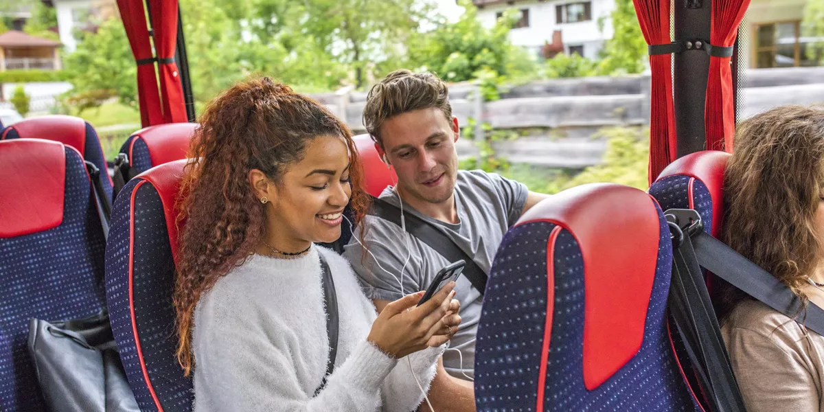 People Lauging In Contiki Coach