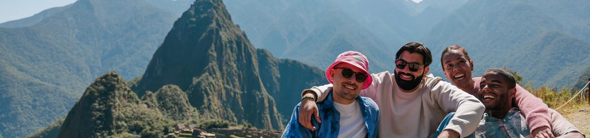 Four Friends Smiling Nature Landscape Mountains At The Background