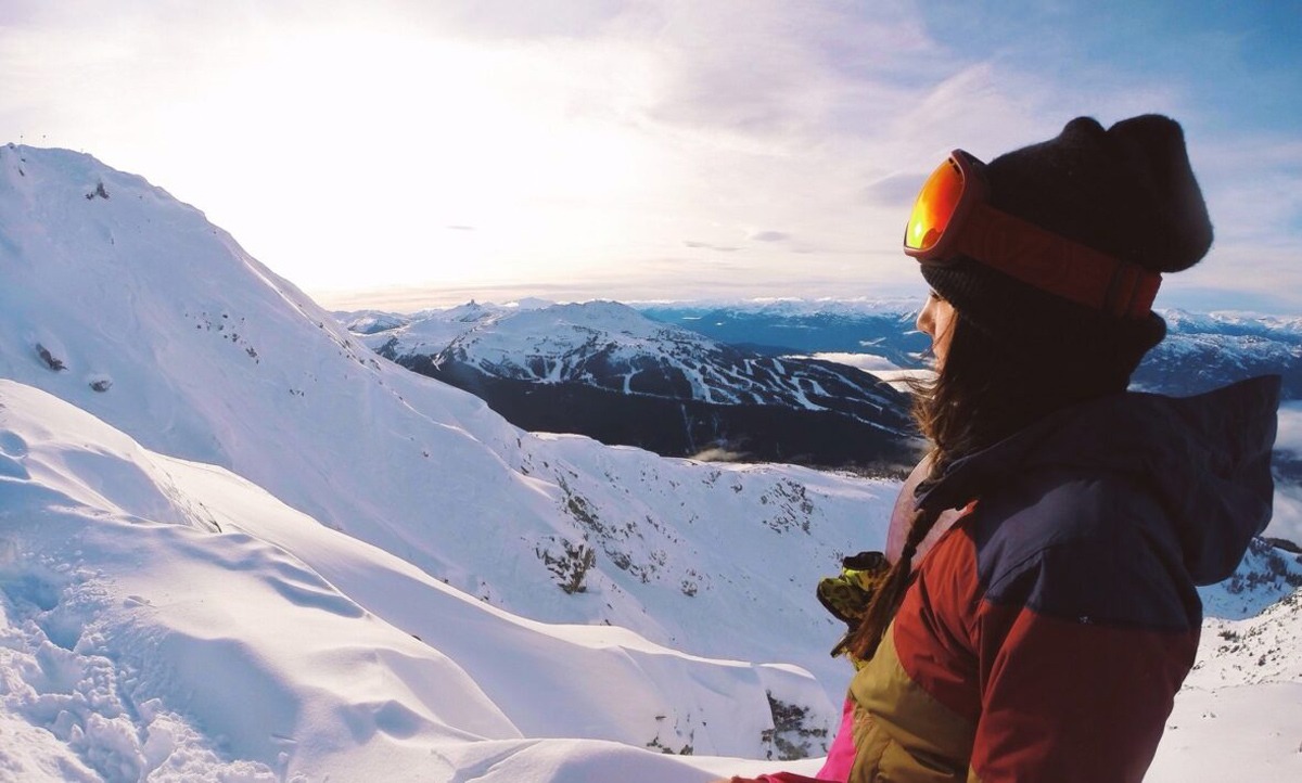 A woman observes the wintry scene