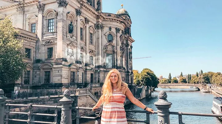 Traveller on a bridge on the River Spree in Berlin, Germany