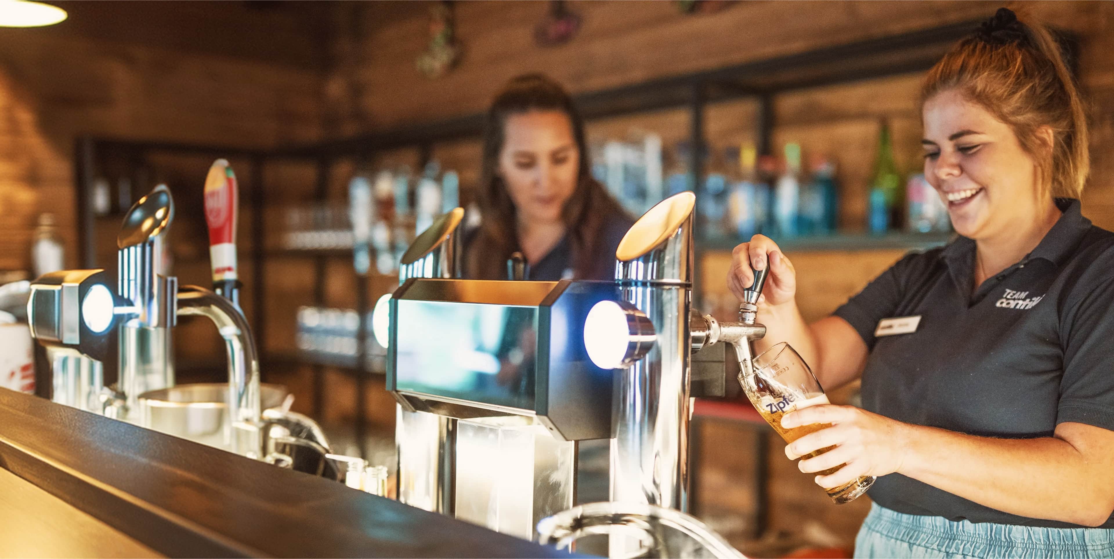Team Members Pouring Beer Hopfgarten Bar Austria