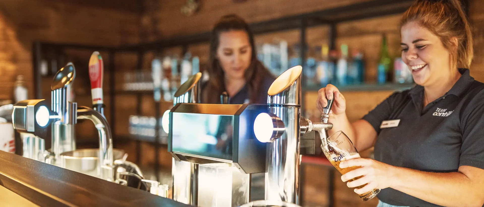 Team Members Pouring Beer Hopfgarten Bar Austria