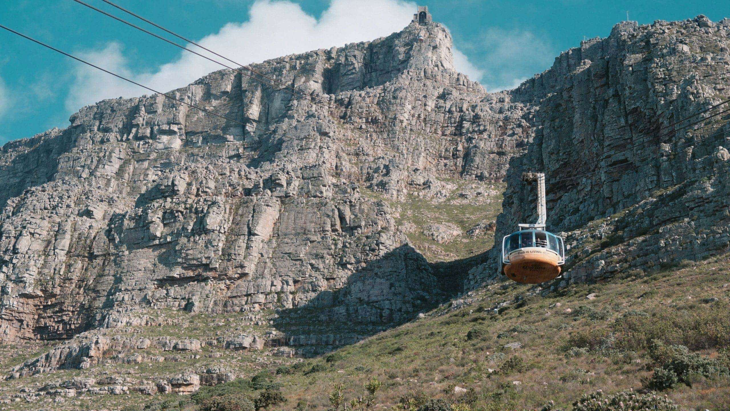 Table Mountain Aerial Cableway climbs the cliffs of Table Mountain in Cape Town, South Africa - Contiki's Cape Town Mini Break Tour