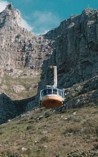 Table Mountain Aerial Cableway climbs the cliffs of Table Mountain in Cape Town, South Africa - Contiki's Cape Town Mini Break Tour