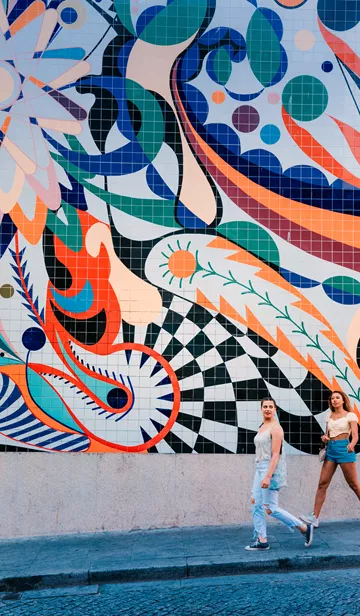Travellers Visiting Street Art In Portugal