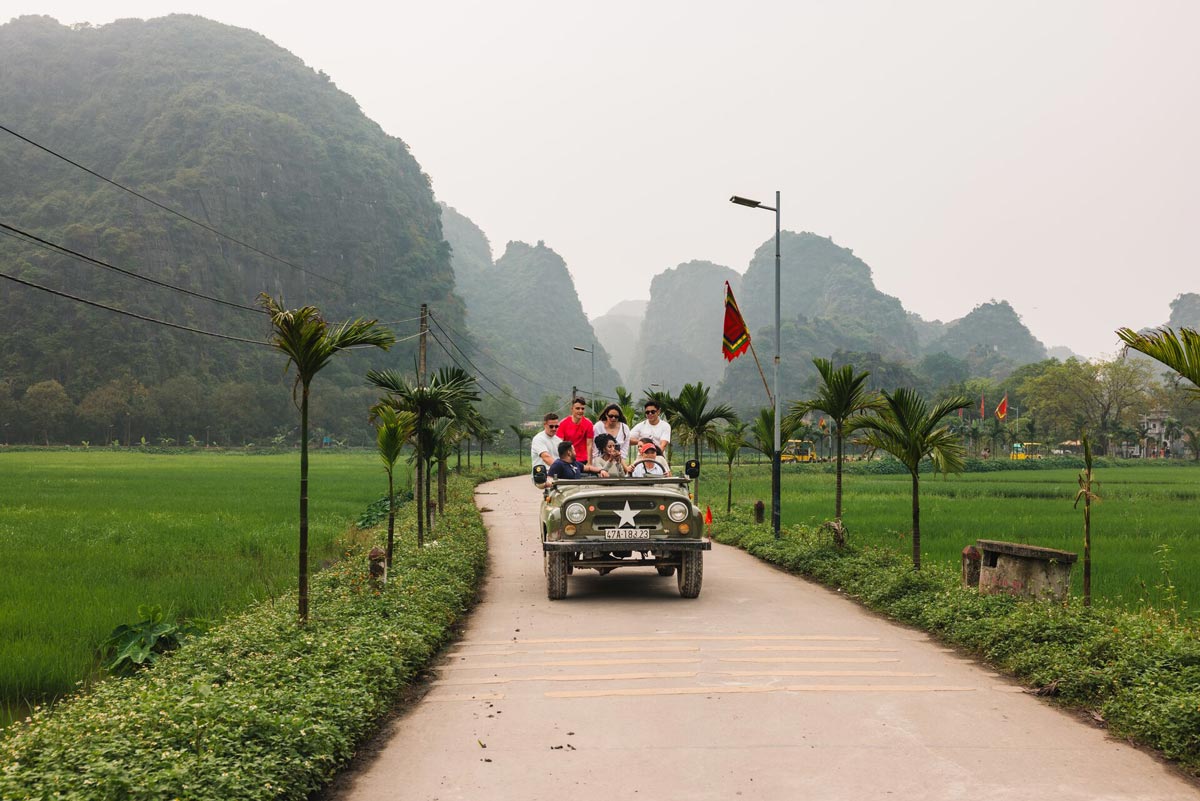 Friends Enjoying A Jeep Ride Green Mountains At The Background