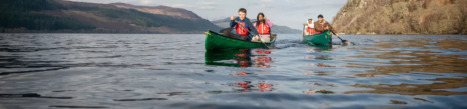 Group In Canoes In Scotland