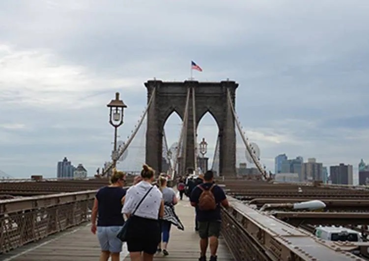 Tourists crossing the Brooklyn Bridge