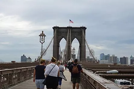 Tourists crossing the Brooklyn Bridge