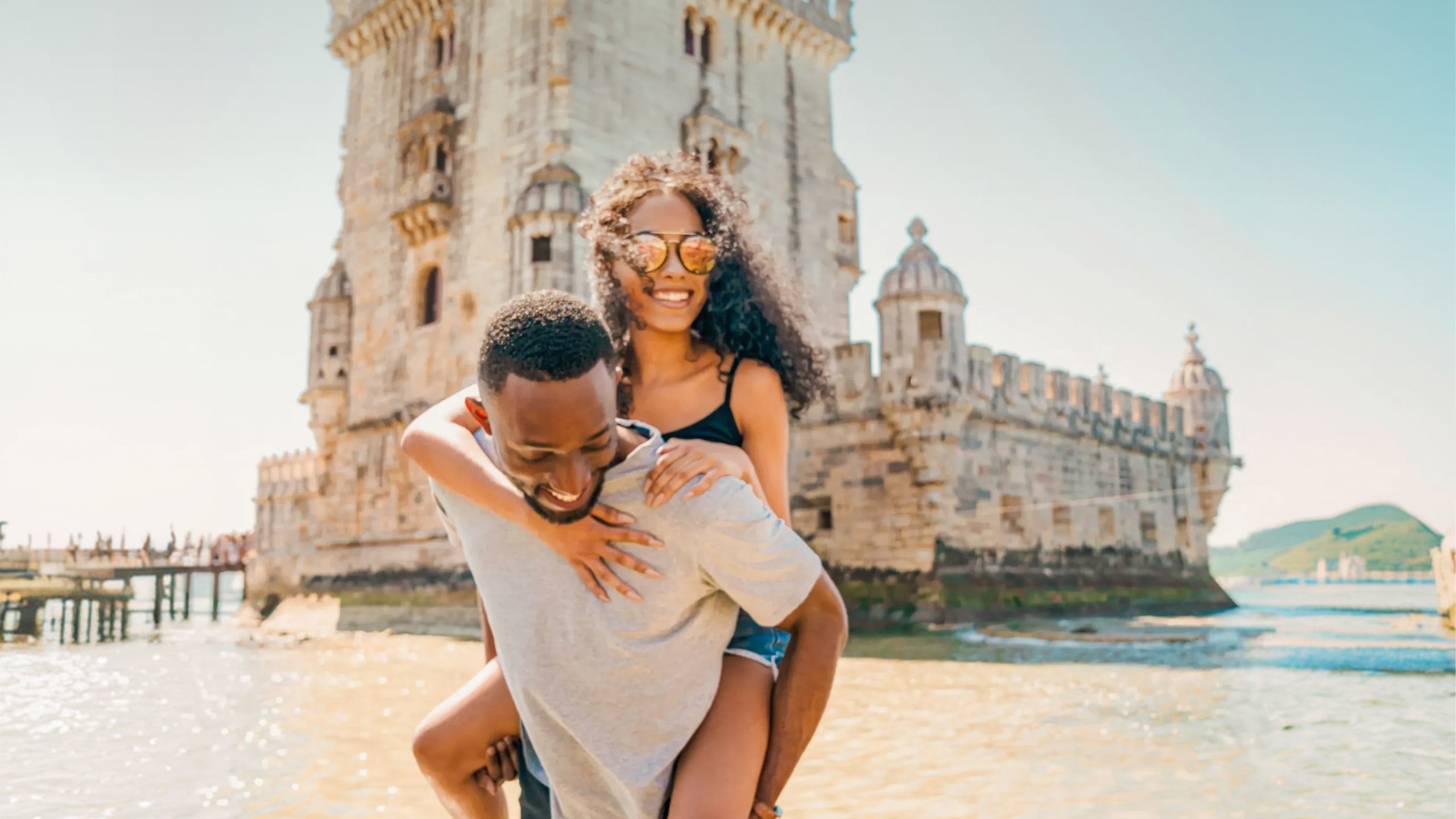 Two travellers exploring Belém Tower in Lisbon - Contiki Spain, Portugal & Morocco Trail Tour