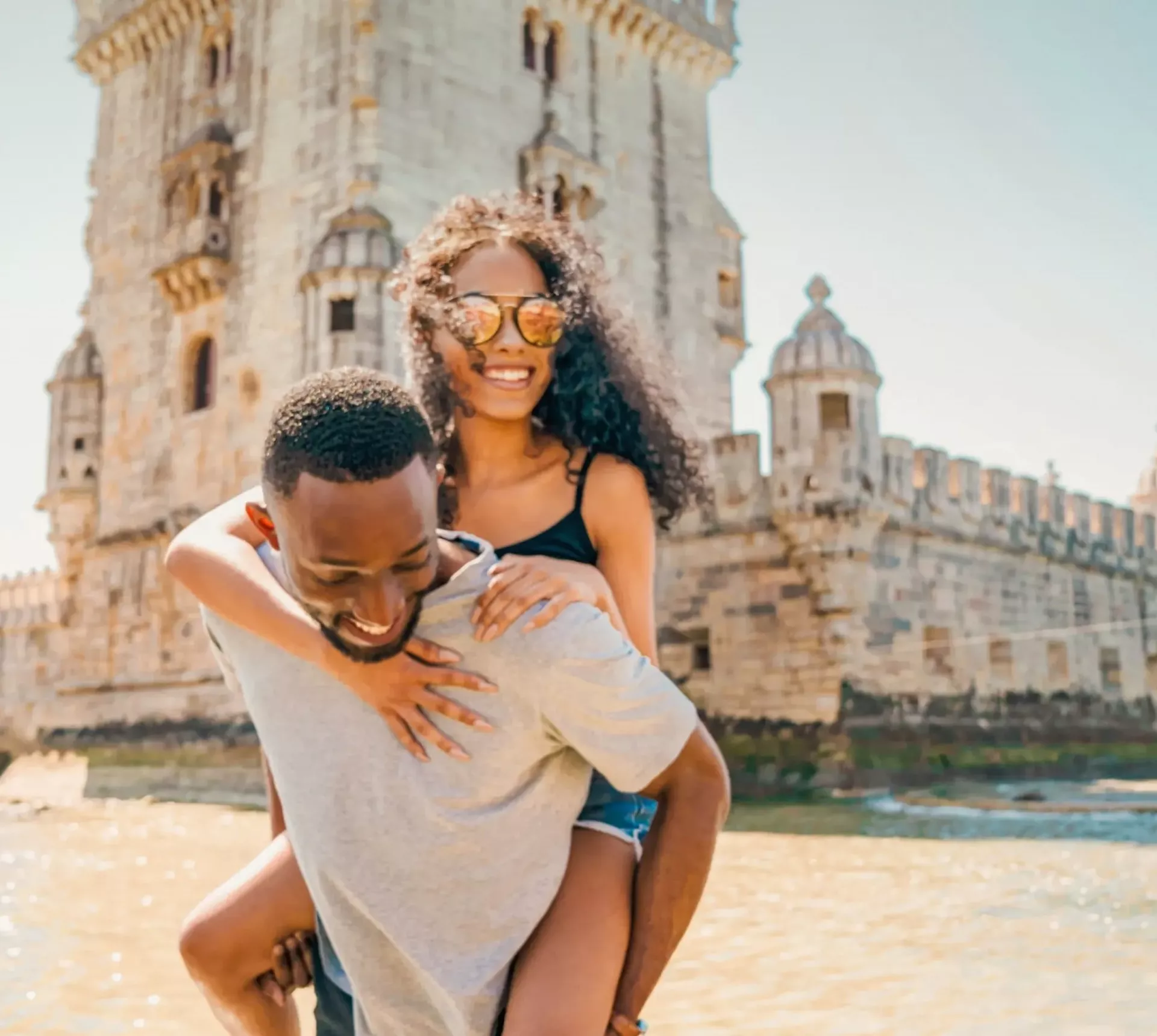 Two travellers exploring Belém Tower in Lisbon - Contiki Spain, Portugal & Morocco Trail Tour