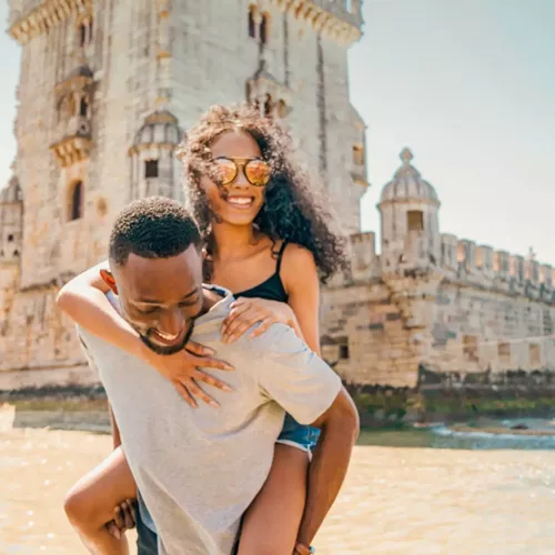 Two travellers exploring Belém Tower in Lisbon - Contiki Spain, Portugal & Morocco Trail Tour