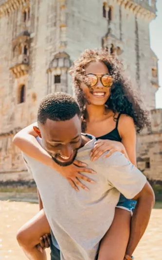 Two travellers exploring Belém Tower in Lisbon - Contiki Spain, Portugal & Morocco Trail Tour