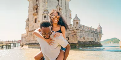 Two travellers exploring Belém Tower in Lisbon - Contiki Spain, Portugal & Morocco Trail Tour