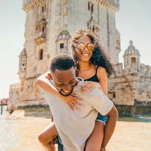 Two travellers exploring Belém Tower in Lisbon - Contiki Spain, Portugal & Morocco Trail Tour